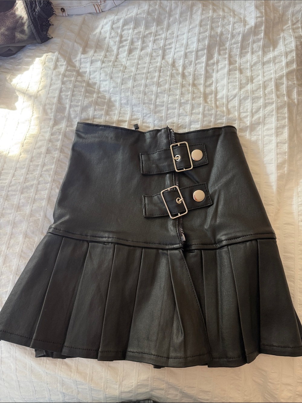 Edikted Black Faux Leather Pleated Mini Skirt with Buckle Accents
